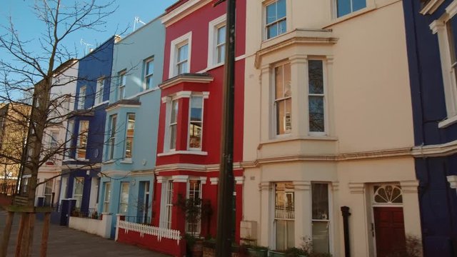 POV shot of beautiful and colorful Victorian houses in Portobello Road, Notting Hill, close to the famous Antiques Market