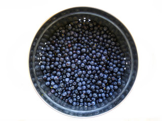 Blueberries. Fresh raw blue berries  isolated on white background. Heap of blueberries, close up, selective focus.