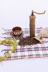 Coffee grinder, coffee beans and cups decoration