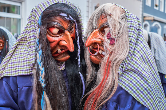 Two witches hug each other. Street Carnival in Southern Germany - Black Forest.