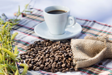 Coffee grinder, coffee beans and cups decoration