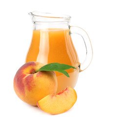 jug of peach juice with peach fruit and slices isolated on white background.