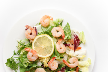 delicious shrimp with salad and lemon
