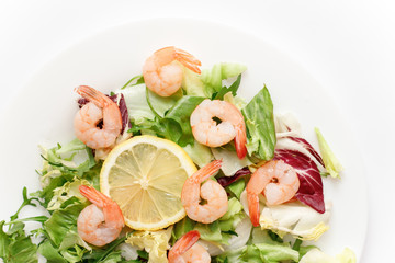 delicious shrimp with salad and lemon