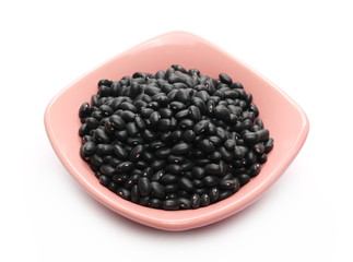 Black beans in bowl isolated on white background