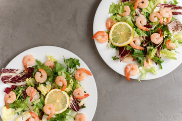 delicious shrimp with salad and lemon