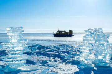 big pile of ice cubes on frozen lake , Russia