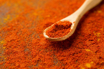 Raw fresh organic and dried ground chili pepper, selective focus