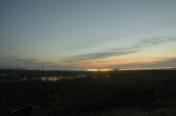 sunset on the swamps near the road
