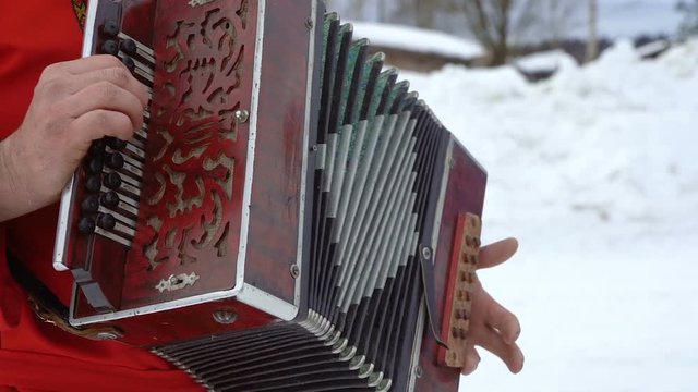 young man playing the accordion
