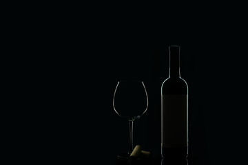 bottle and glass of red wine