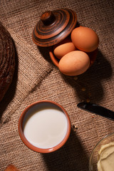 organic dairy products - milk, cheese, and also eggs, bread. on table