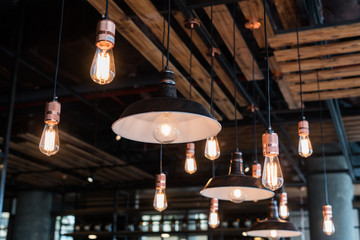 Vintage light bulbs handing from ceiling, industrial decoration