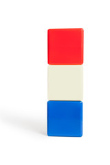 flag colors of Netherlands: red, white, blue in the form of children's cubes. On white background isolated with shadow