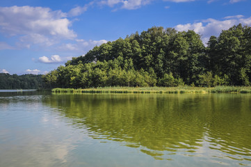 Fototapeta na wymiar Shore of Lanskie Lake in Olsztyn Lake District, near Lansk village in Warmian-Masurian Voivodeship of Poland