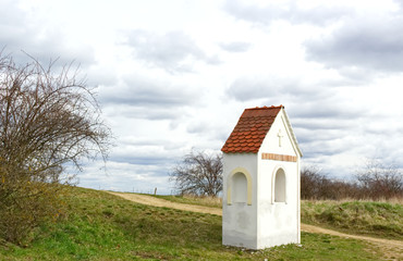 Old chapel on the Way of the Cross. Czech Republic, Beautiful spring landscape in the Podyj National Park. Czech Republic.The chapel is in the foreground. Evening light, retro look.