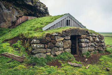 Turf cottage next to Cave of Rutur - Rutshellir in south part of Iceland