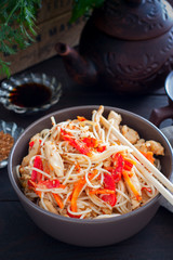 Rice noodles with chicken and vegetables, selective focus