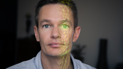 Facial recognition scanning a person's face