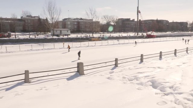 The worlds largest skating rink, between pretoria bridge and the University of Ottawa. Skaters enjoying the ice! :)