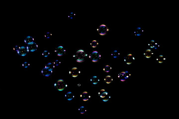 Photography of bubbles floating on black background