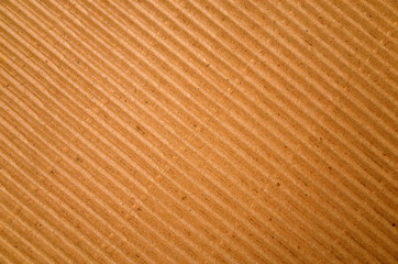 Brown corrugated cardboard paper background with diagonal lines