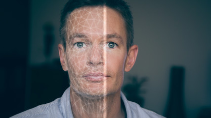 Facial recognition scanning a person's face