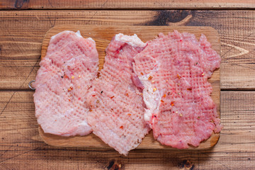 Step by step preparation of pork rolls with mushrooms - step 2 - meat preparation, chops, top view, horizontal