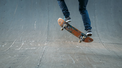 Urban man hobby. Skateboarding leisure and practice. Guy performing trick. Skate park area. Action shot. Copy space.