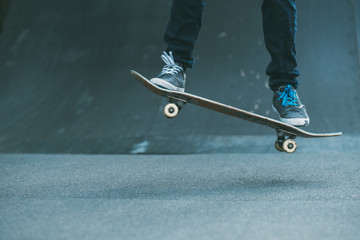 Urban man hobby. Skateboarding leisure and practice. Guy performing trick. Skate park ramp. Action...