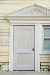 Pastel door, front exterior of the urban house