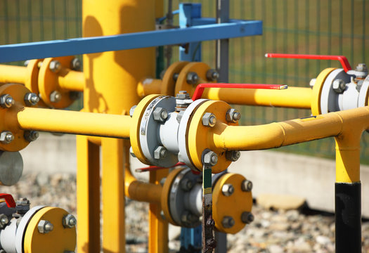 Element gas line high and medium pressure. Yellow transport pipes on the surface of the fence. Regulatory supply system for natural compressed fuel. Access overlap valves and pressure sensors