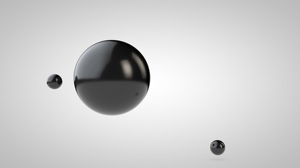 3D illustration of black balls, one large and two small balls. spheres in the air, isolated on a white background. 3D rendering of an abstraction. Space with geometric objects.