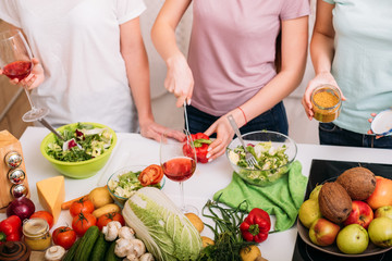 Obraz na płótnie Canvas Healthy nutrition. Vegan friend lifestyle. Females cooking. Fruit and vegetables assortment.