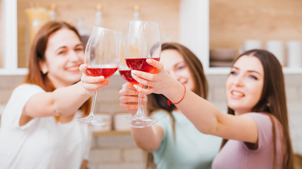 Cheers. Party, celebration and girls hangout leisure. Women toasting with glasses of red wine. Alcohol abuse