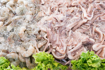 Squids and shrimps in ice, fresh seafood street in Thailand
