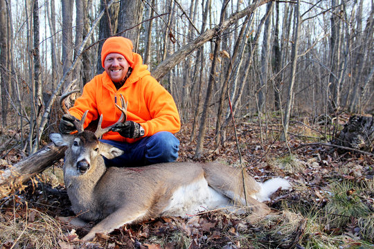 Hunter With A Harvested Whitetail Buck