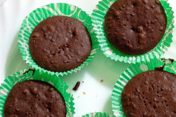 Sweet chocolate muffins with pieces of chocolate.
