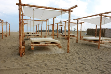 Tents on a sandy beach after rain in the village of Sveti Vlas in Bulgaria..
