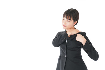 肩こり・腰痛に苦しむ若いビジネスウーマン
