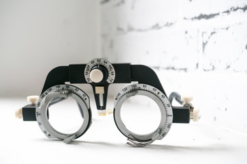 Manual eyes sight examination tools with a set of trial lenses for a phoropter used for eye exam