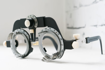 Manual eyes sight examination tools with a set of trial lenses for a phoropter used for eye exam