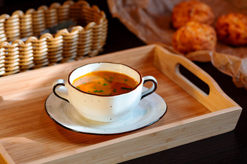 soup in a cup with buns