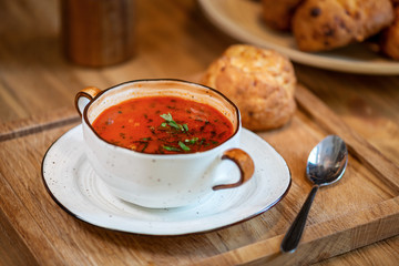 soup in a cup with buns