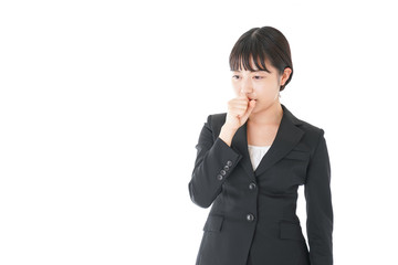 風邪をひいた若いビジネスウーマン