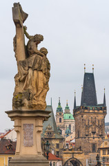 Fototapeta na wymiar Prague, Czech Republic. The statue of St. Lutgardis is an outdoor sculpture of the Charles Bridge. On the statue in Latin words 