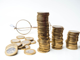 background of financial and accounting concept with coin stacks, glasses, selective focus Concepts of tax planning