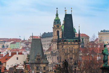 Fototapeta na wymiar Prague, Czech Republic. Tops of the buildings and the Mala Strana Bridge Towers of the Charles bridge.