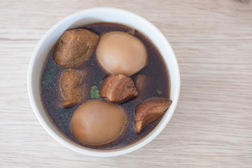 Thai cuisine boiled eggs with chicken drumstick in sweet gravy