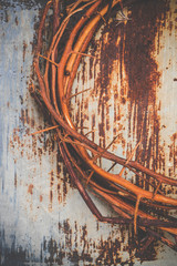 Thorn crown on rusty surface steel background
